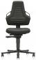 Preview: The office chair has a high backrest with a modern, triangular shape. It is black and has a padded seat. The armrests are attached to the sides. The chair has casters.