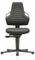 Preview: The office chair is black and features an ergonomic backrest with cutouts. The seat is padded, and the chair has casters as well as a height adjustment.