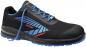 Preview: The shoe is black with blue and red details. It has comfortable laces, a lightweight upper, and a non-slip sole, ideal for work or leisure.