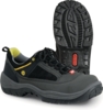 Preview: The image shows a pair of black sports shoes with yellow and gray accents. The sole is grippy and heavily treaded, ideal for outdoor activities. The shoe has a laced front.