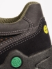 Preview: The image shows a black shoe with gray upper and green sole. It features lacing and prominent, yellow branding. The texture appears sturdy and athletic.