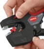 Preview: The image shows a hand holding a wire stripper from Knipex. The pliers have a black surface with red accents and various adjustment markings.