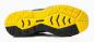 Preview: The image shows the underside of a shoe with a non-slip tread. The sole is predominantly black but features striking yellow elements and various structural patterns that provide grip.