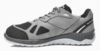 Preview: The shoe is a sporty, gray sneaker with black fabric on the tip and side panels. The sole is light, with a sturdy tread for better grip.