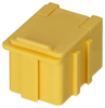 Preview: The image shows a small, square box made of yellow plastic. It has a slightly raised lid and lateral grooves. The box appears sturdy and has a simple, functional shape.