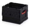 Preview: The image shows a black plastic box in a crate format. It has a textured side surface and a red handle on the front. The box is open and has sturdy, solid walls.