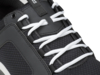 Preview: The image shows a black sports shoe with white, braided laces. The surface texture appears breathable, featuring a simple, modern design.