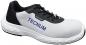 Preview: The image shows a work shoe. It has a gray and black color, is sporty cut, and has a reinforced toe cap. On the side, the word "TECNUM" is displayed.