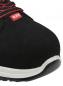 Preview: The image shows the front view of a black shoe with a red logo. The shoe has a sturdy construction and a bright, non-slip sole. Laces are visible.