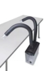 Preview: The image depicts a device with two long, flexible hoses that bend upwards. It is placed on a table and has a black, square base with controls on the side.