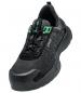 Preview: The shoe is a sporty sneaker with a black surface that has small, bright dots. It features green accents and a sturdy, rubberized sole edge for good grip.