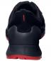 Preview: The image shows the rear view of a black sports shoe. The sole is red, and there is a high, padded heel. A gray area on top complements the design.