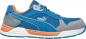 Preview: The shoe is a sporty sneaker in blue with gray and orange accents. It has a cushioned sole and breathable material for comfort. The logo is clearly visible.