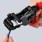 Preview: The image shows a hand holding a black cable cutter with red handles. The cutter has an open design and is used to strip a blue cable.