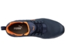 Preview: The image shows a dark blue sports shoe with orange accents. It has a modern design, a cushioned sole, and lacing. The brand logo is visible.