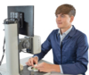 Preview: A young man is sitting at a table, in front of him a monitor and a magnifying device. He is looking intently at a small object that he is holding with one hand.