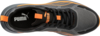 Preview: The image shows a sports shoe in gray with black and orange accents. The upper part is made of breathable material, and the laces are black. A Puma logo is visible.