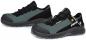 Preview: The image shows a pair of athletic shoes in black and gray. They have a padded sole and a breathable upper with laces. The design appears sturdy and functional.