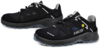 Preview: The image shows a pair of black athletic shoes. They have a lightweight, breathable upper with mesh inserts and a reinforced, non-slip sole. The laces are elastic.