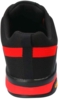 Preview: The image shows a sports shoe from the back. The shoe is primarily black with red stripes. The sole is sturdy and has a shallow tread. The material appears breathable and durable.