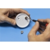 Preview: A hand is holding a screwdriver, currently turning a screw into a round white component. Next to it, a small metal washer lies on a blue surface.