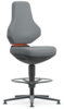 Preview: The chair has a gray, ergonomic backrest and seat. It stands on a black base with a round footrest. The design is modern and simple, with an orange accent.