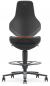 Preview: The office chair has a black, ergonomic backrest with a curved shape. The seat is also black and features an orange control strip. It stands on a five-spoke base with casters.