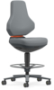 Preview: The office chair has a high backrest and a padded seat. It is gray with an orange accent and stands on a swivel base with casters. A foot ring is present.