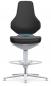 Preview: The chair has a high, curved backrest and a padded seat in black. The base is silver-colored with a round foot and a foot ring for support.