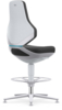 Preview: The image shows a modern office chair with a high, ergonomic backrest in light and dark colors. It features a round footrest and an adjustable, silver base.