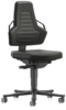 Preview: The office chair features an ergonomic, green backrest with side handles and a lightly padded seat. It is mounted on a wheeled base that facilitates mobility.