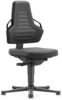 Preview: In the picture, there is a black office chair. It has a high backrest with a textured surface and wide armrests. The seat is flat and the chair is on a stable base with casters.