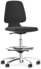 Preview: The chair has a black, padded seat and backrest. It stands on a chrome-plated frame with five casters. The height is adjustable, and it has a foot ring for support.