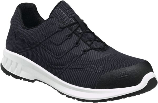 The shoe is a black sports or safety shoe with laces. It has a sturdy, rubberized toe and a white sole that provides good cushioning. The surface is textured and breathable.