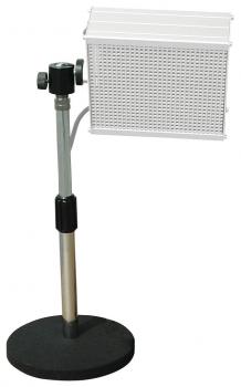 The image shows a floor lamp with a sturdy, round black base. The lamp arm is silver, and the lampshade is rectangular with a perforated pattern.