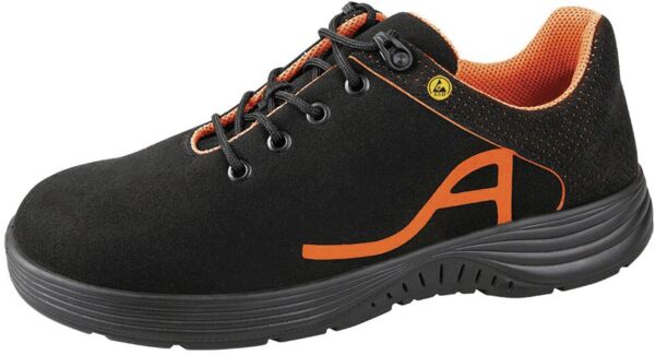 The shoe is black with orange accents. It has a solid sole, laces, and the lining is orange. The shape is sporty and suitable for everyday wear or light activities.