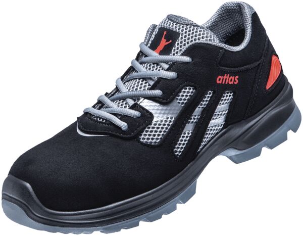 The shoe is a sporty safety shoe in black with gray and red accents. It has a breathable, mesh upper and a sturdy, non-slip sole.