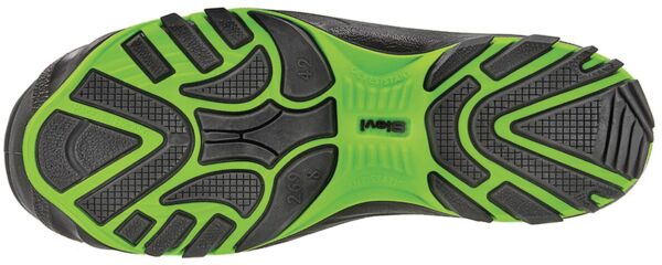 The sole of a sports shoe is primarily black with green rubber inserts. It has a textured profile with patterns for better grip and flexibility.