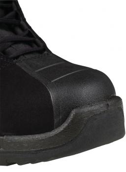 The image shows the front of a black safety shoe. It has a sturdy, smooth toe cap and a thick, treaded sole. The laces are visible.