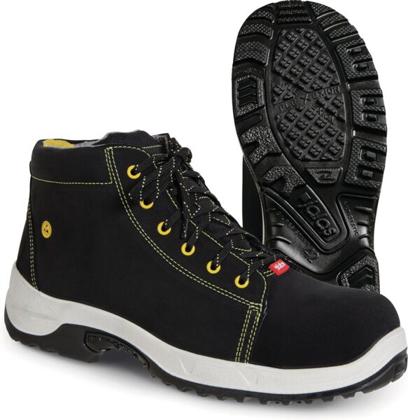 The image shows a pair of black safety shoes with yellow accents. The shoes have a high-top design, laces, and a non-slip, textured sole. The heel is stable.