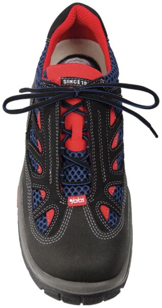 The image displays a sports shoe. It is primarily black with red and blue accents. The shoelaces are black, and the shoe features a thick, grippy sole. The design appears functional and modern.