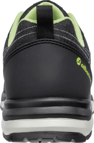 The image shows the rear view of a black sports shoe with green accents. The sole is sturdy, and a pull tab is attached at the heel. The shoe looks modern and sporty.