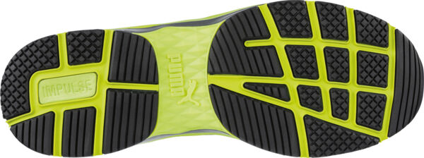 The image displays the underside of a sports shoe. The sole features a striking pattern of black and bright yellow rubber zones, which provide good grip and cushioning.