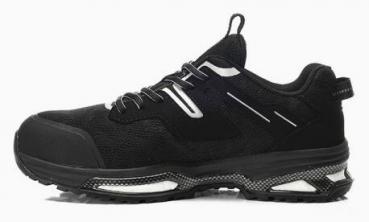 The shoe is black with a sporty shape. It has a padded sole, laces, and reflective elements. The front is reinforced for added protection.