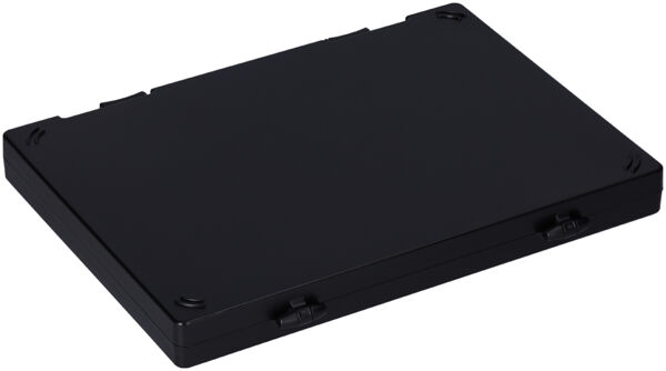 The image shows a flat, rectangular black box. It has rounded corners and four small holes at the corners, possibly for mounting or attachment.