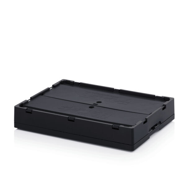 The image displays a rectangular, black, flat box with a curved lid. It has rounded edges and two small holes in the center, which may serve for ventilation or transport.