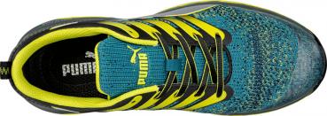 The image shows a sports shoe from above. It features a colorful upper in turquoise and yellow, with black laces and a sturdy, non-slip sole. The shoe is narrower at the forefront.