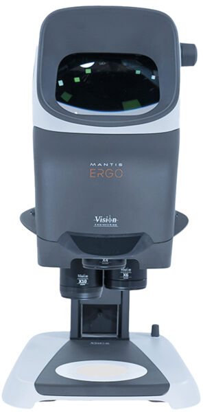 The image shows an ergonomic optical device named Mantis Ergo. It has a large, rounded top area, a stable base, and two magnifying lenses underneath.