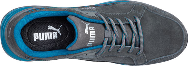 The image displays the upper part of a gray Puma sneaker with blue accents. The laces are braided, and the logo and brand are visible inside.