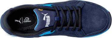 The shoe is dark blue with black laces. On the side, there is a blue accent and the Puma logo in white. The insole provides additional comfort.